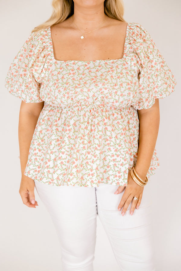 Chic Soul plus size clothing, white top with a square neckline and bubble sleeves as well as a orange floral pattern throughout 