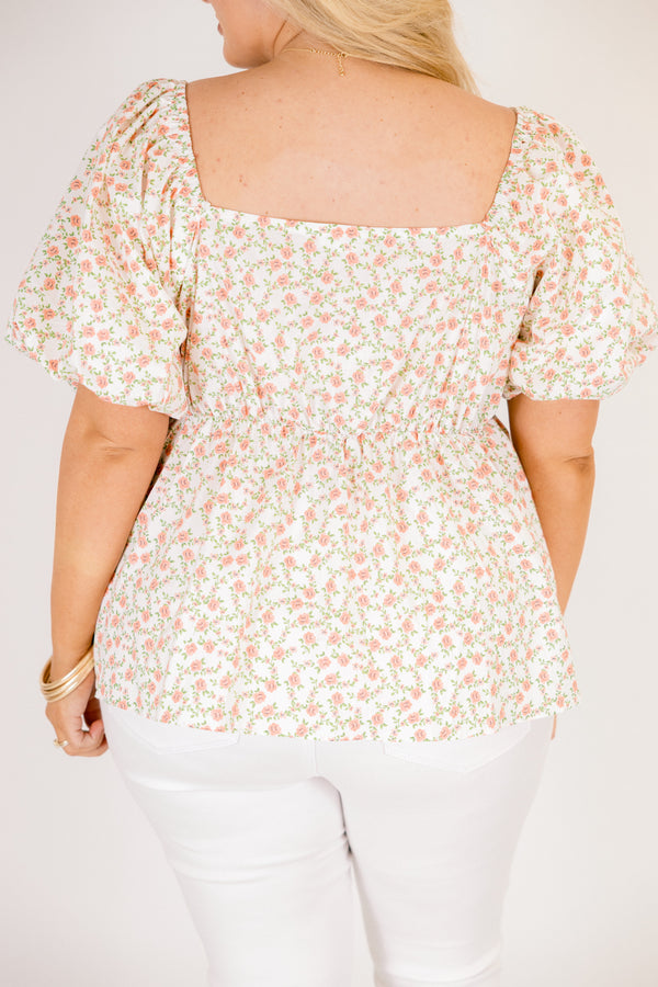 Chic Soul plus size clothing, white top with a square neckline and bubble sleeves as well as a orange floral pattern throughout 