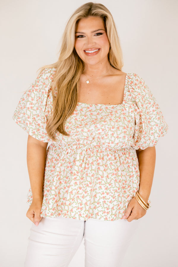 Chic Soul plus size clothing, white top with a square neckline and bubble sleeves as well as a orange floral pattern throughout 