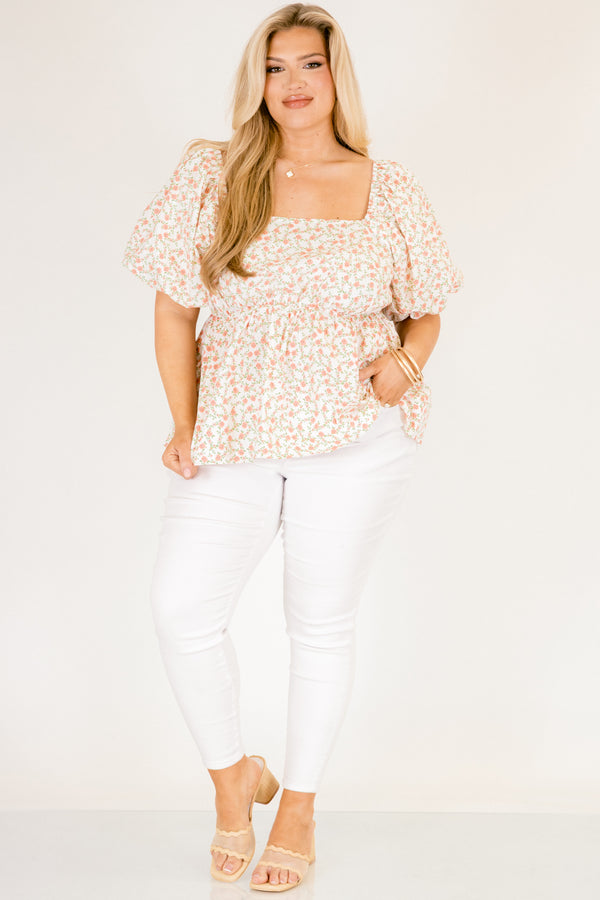 Chic Soul plus size clothing, white top with a square neckline and bubble sleeves as well as a orange floral pattern throughout 