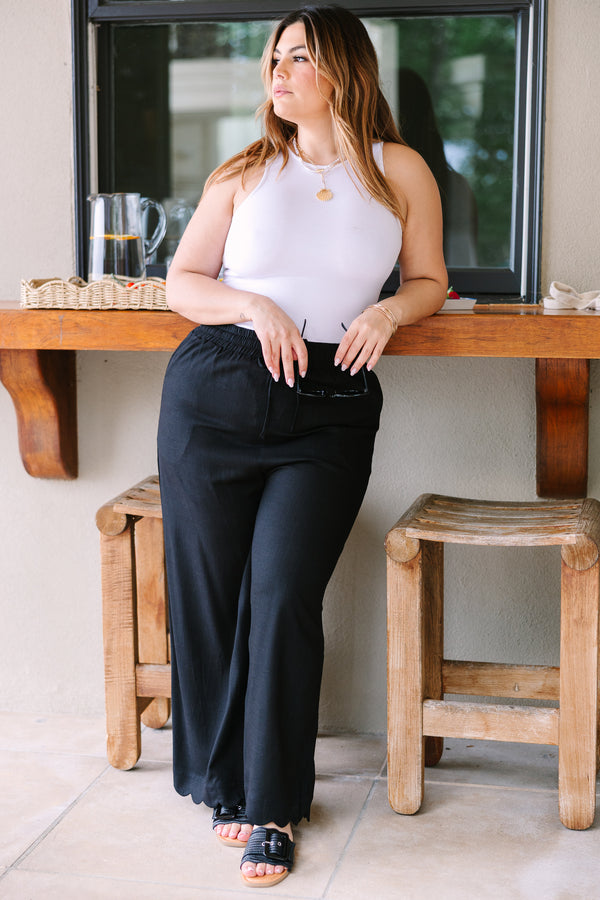 Plus Size wide-leg black linen pants with an elastic drawstring waistband.