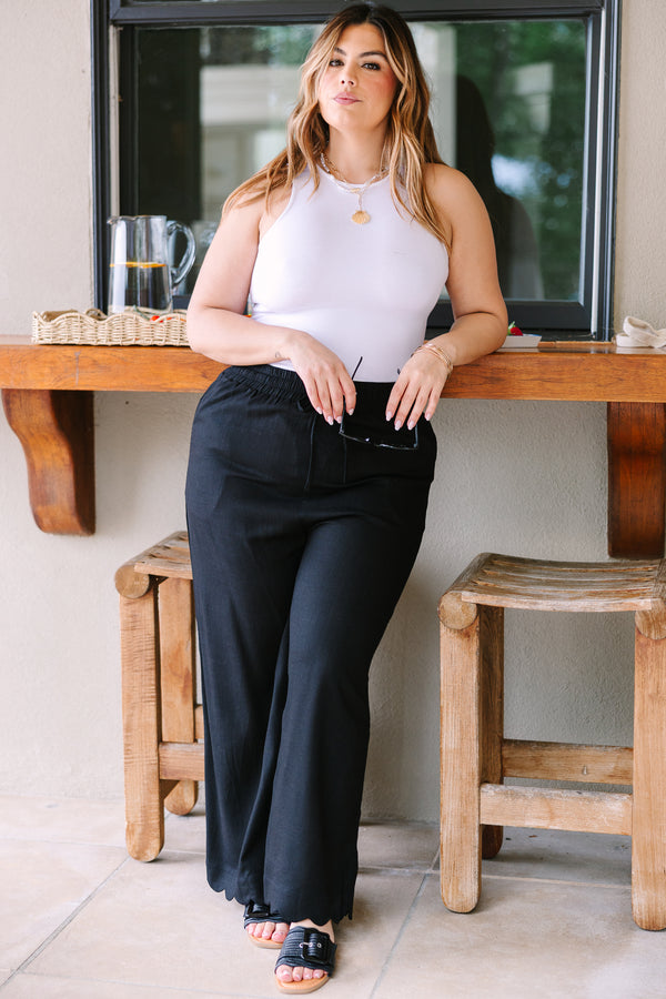 Plus Size wide-leg black linen pants with an elastic drawstring waistband.