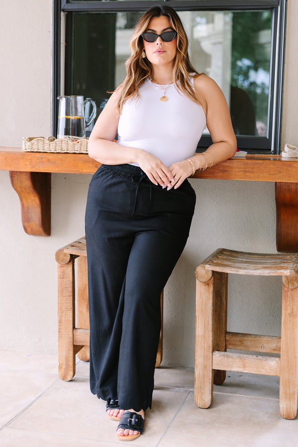 Plus Size wide-leg black linen pants with an elastic drawstring waistband.