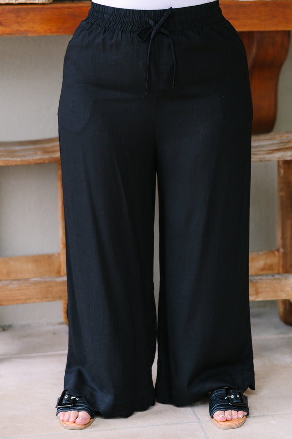 Plus Size wide-leg black linen pants with an elastic drawstring waistband.