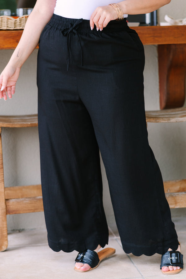 Plus Size wide-leg black linen pants with an elastic drawstring waistband.