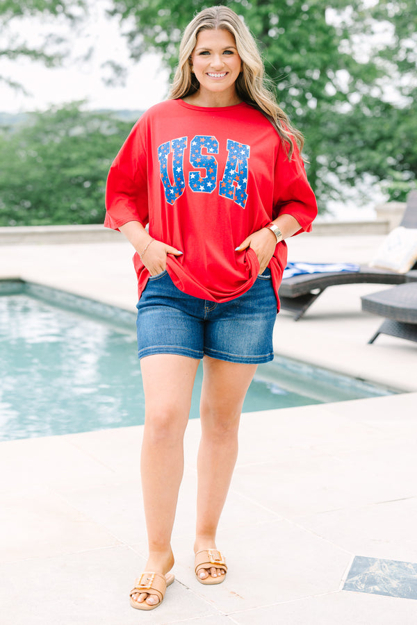 Red oversized boyfriend tee with a crew neck and blue starry USA graphic on the front.