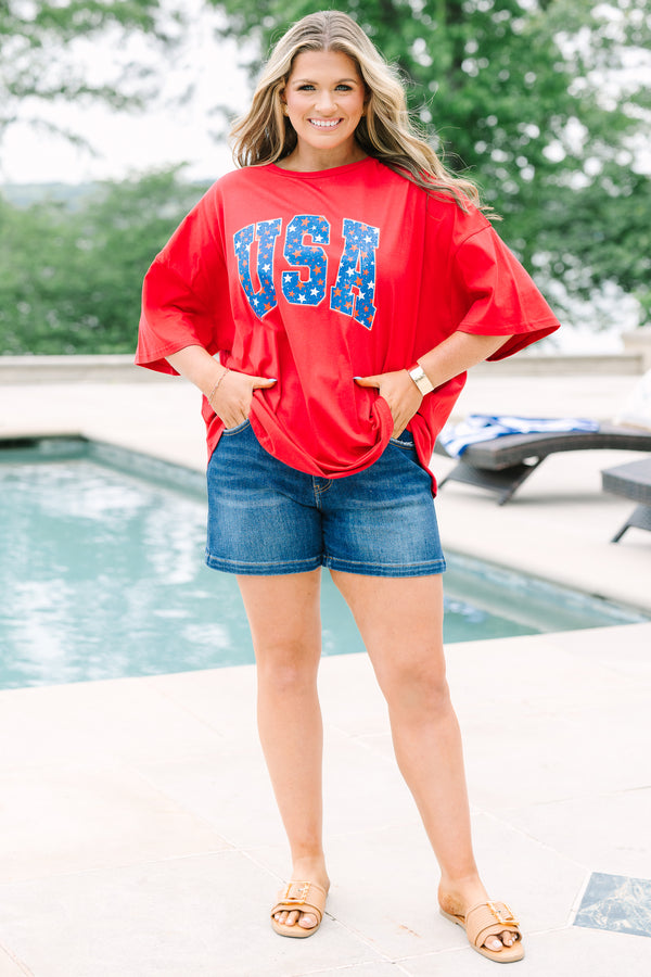 Red oversized boyfriend tee with a crew neck and blue starry USA graphic on the front.