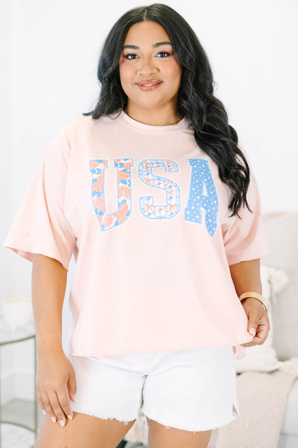 Plus Size blush pink vintage wash tee with USA floral and star patchwork lettering.
