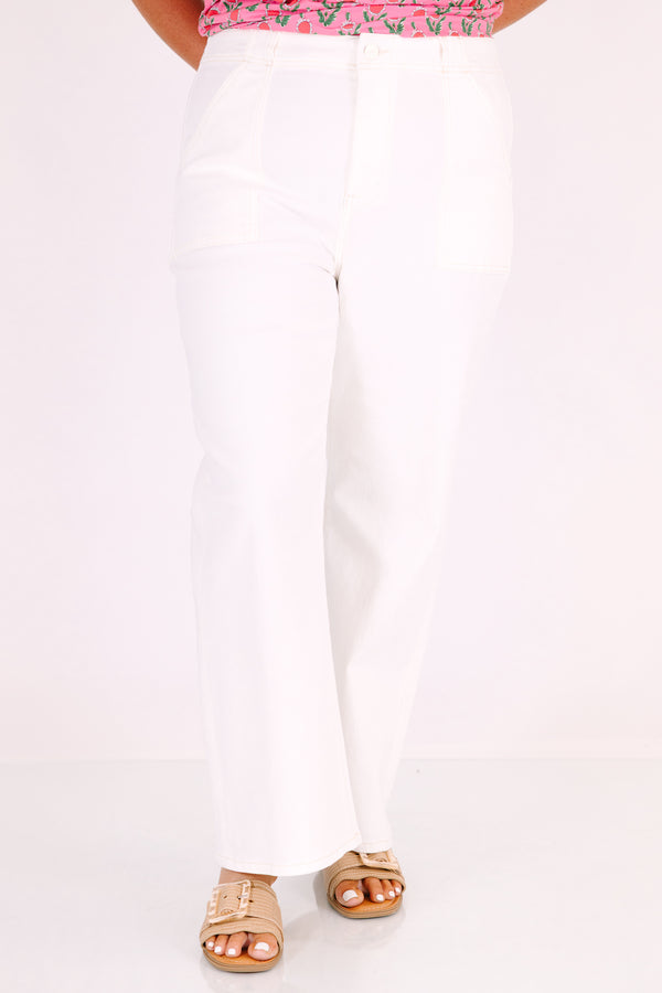 High-rise cream ankle flare jeans with front patch pockets and a button fly.