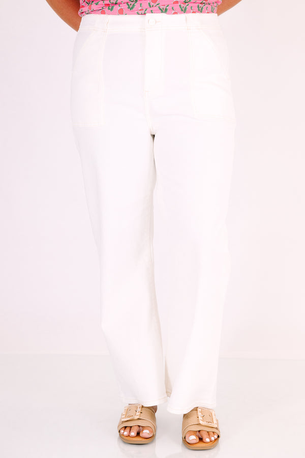 High-rise cream ankle flare jeans with front patch pockets and a button fly.