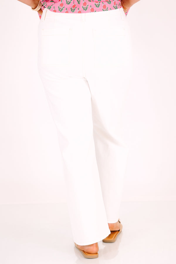 High-rise cream ankle flare jeans with front patch pockets and a button fly.