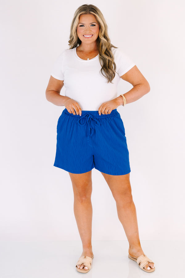 Chic Soul plus size clothing, royal blue shorts with pockets and a draw string waistband as well as a subtle wavy print throughout 