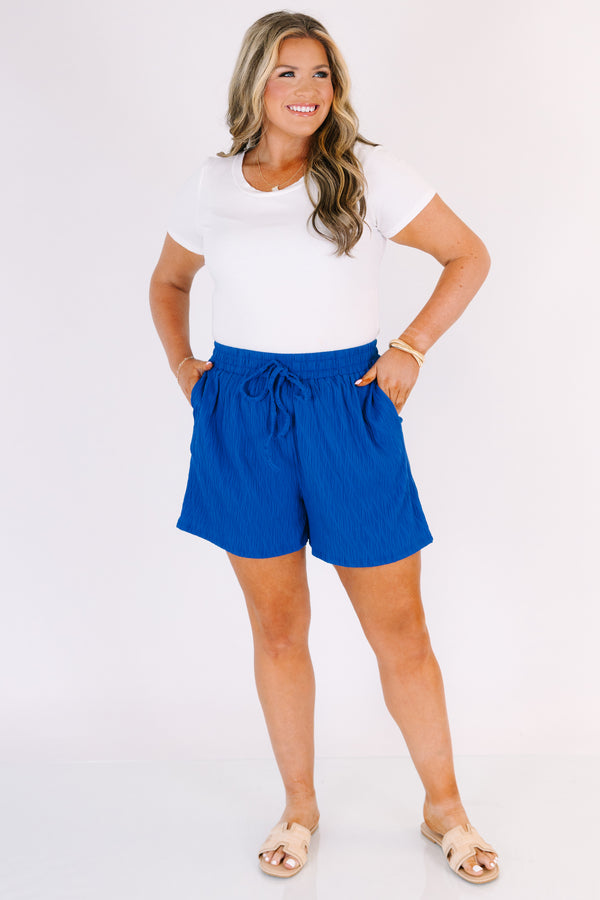 Chic Soul plus size clothing, royal blue shorts with pockets and a draw string waistband as well as a subtle wavy print throughout 