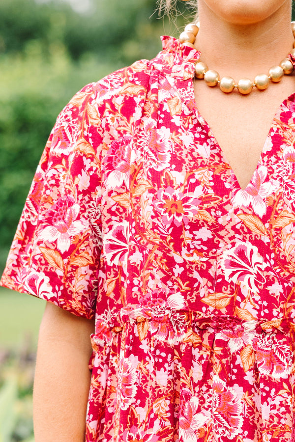 Plus Size pink floral tiered midi dress with short sleeves, a V-neckline, and a relaxed fit.
