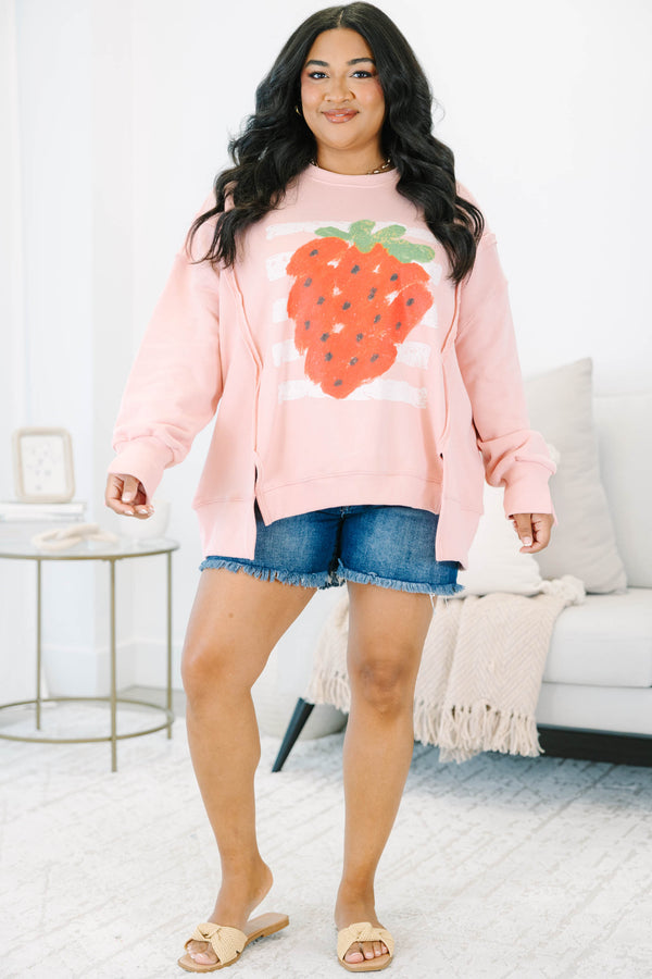 Plus Size dusty pink crewneck sweatshirt with a large strawberry graphic and side slits.
