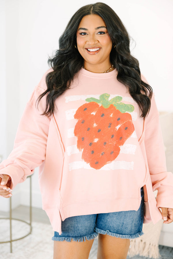 Plus Size dusty pink crewneck sweatshirt with a large strawberry graphic and side slits.