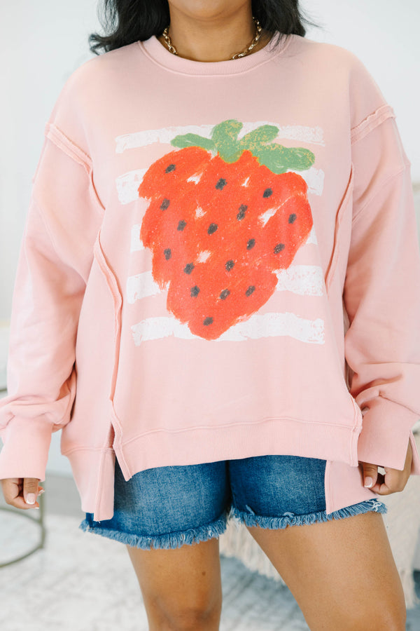 Plus Size dusty pink crewneck sweatshirt with a large strawberry graphic and side slits.