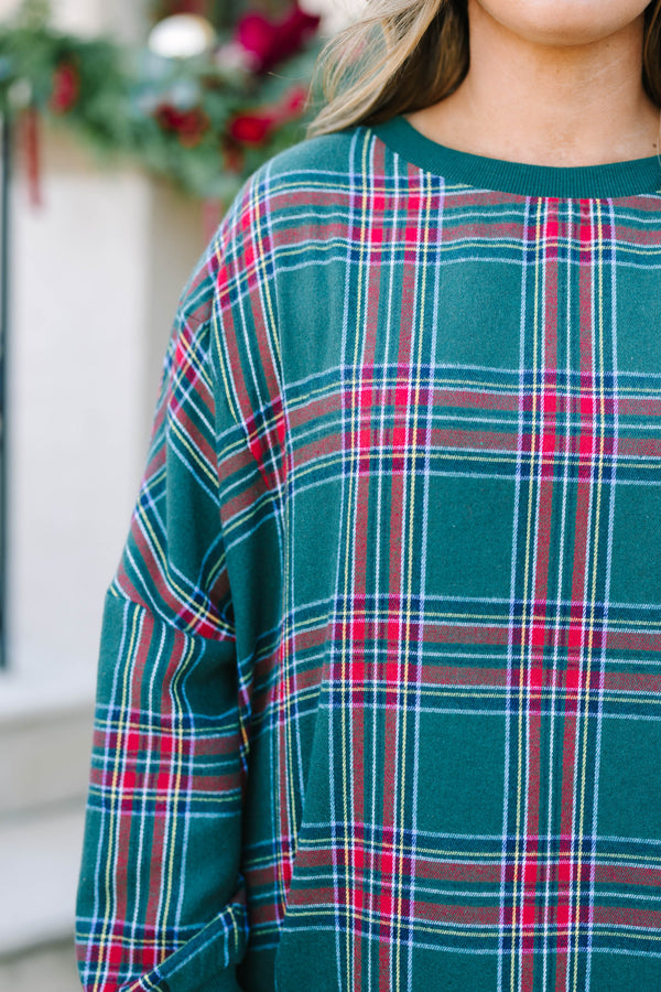 Plus Size green plaid pullover with a crew neckline, oversized fit, and ribbed trim.