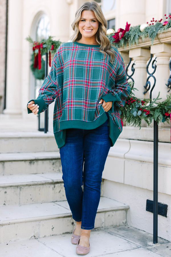 Plus Size green plaid pullover with a crew neckline, oversized fit, and ribbed trim.