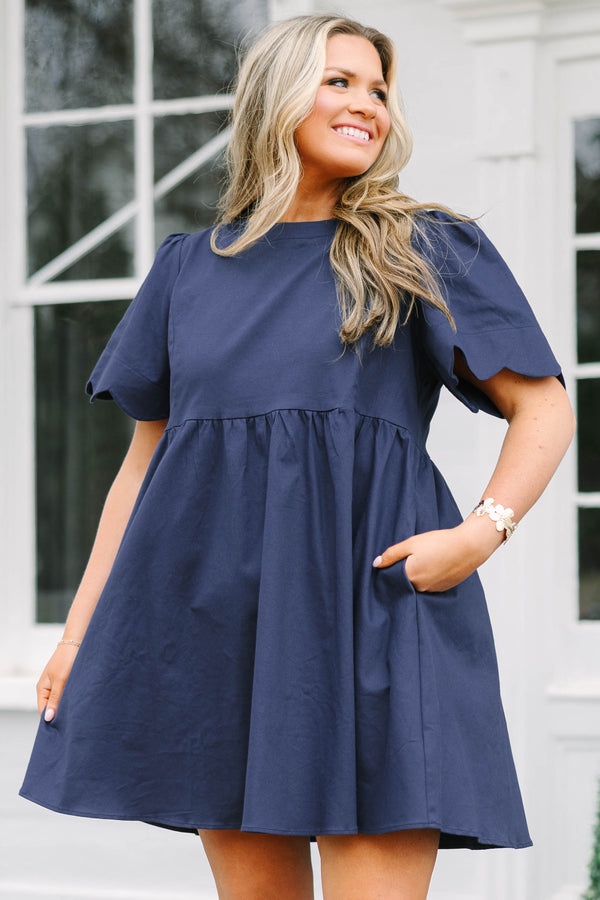 Chic Soul plus size clothing, navy flowy knee length dress with short bell sleeves that have a scalloped look at the end of the sleeves