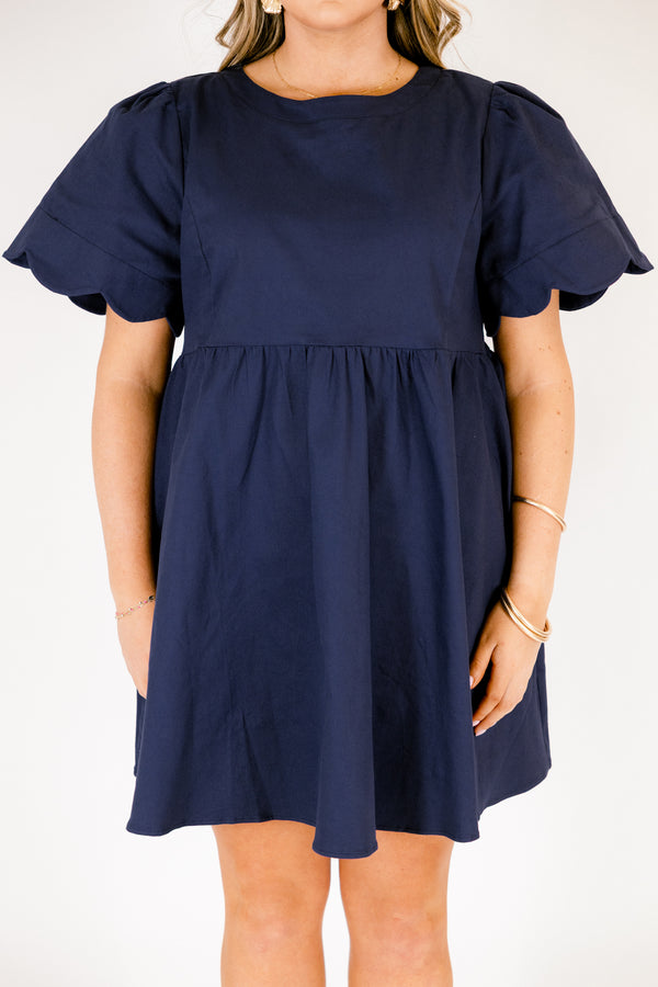 Chic Soul plus size clothing, navy flowy knee length dress with short bell sleeves that have a scalloped look at the end of the sleeves