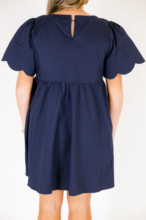 Chic Soul plus size clothing, navy flowy knee length dress with short bell sleeves that have a scalloped look at the end of the sleeves