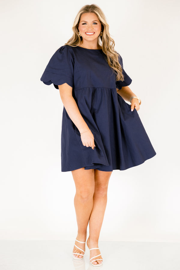 Chic Soul plus size clothing, navy flowy knee length dress with short bell sleeves that have a scalloped look at the end of the sleeves