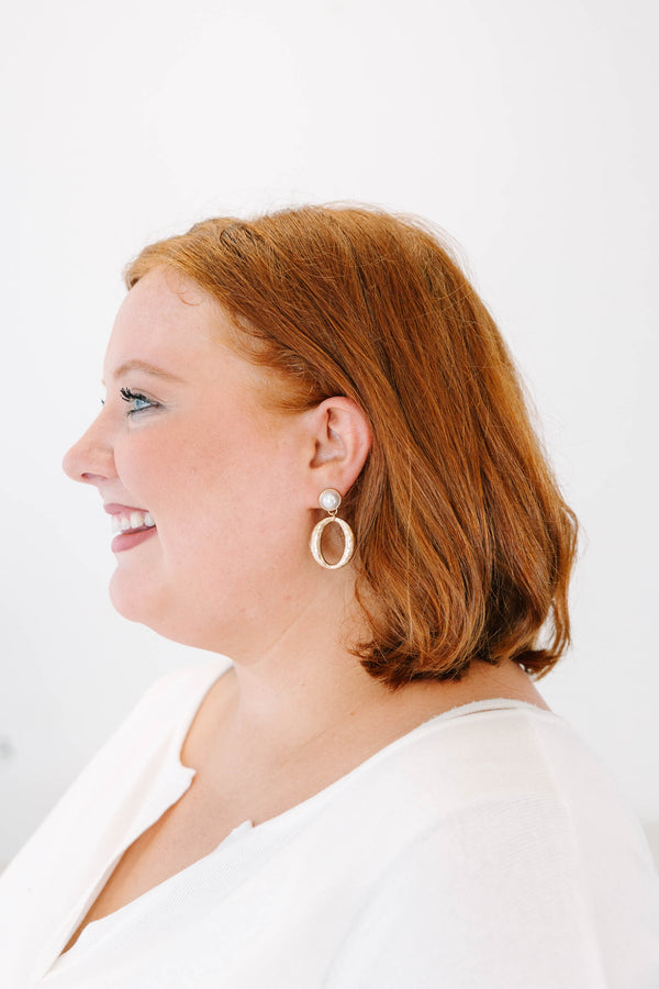 Plus Size gold-toned drop earrings featuring a pearl stud and a hammered oval hoop.