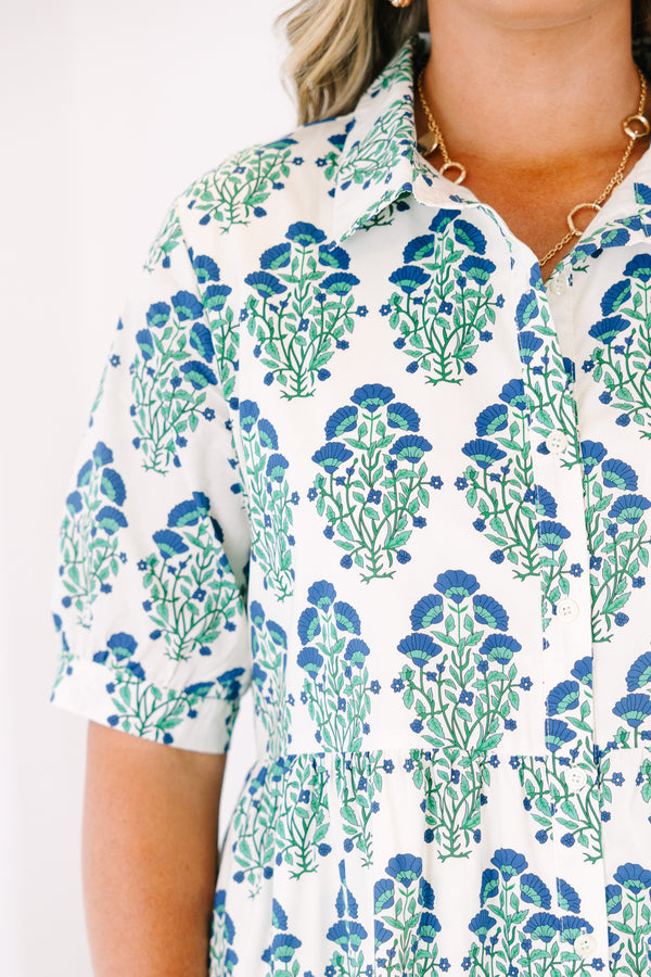 Plus Size green and blue floral block print midi dress with short sleeves and a tiered skirt.