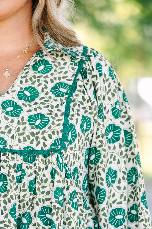 Plus Size green floral print top with long sleeves, a V-neckline, and a loose, flowy fit.