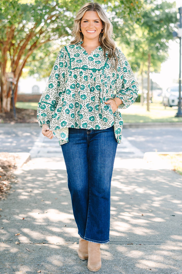 Plus Size green floral print top with long sleeves, a V-neckline, and a loose, flowy fit.
