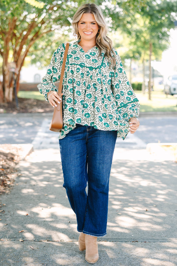 Plus Size green floral print top with long sleeves, a V-neckline, and a loose, flowy fit.