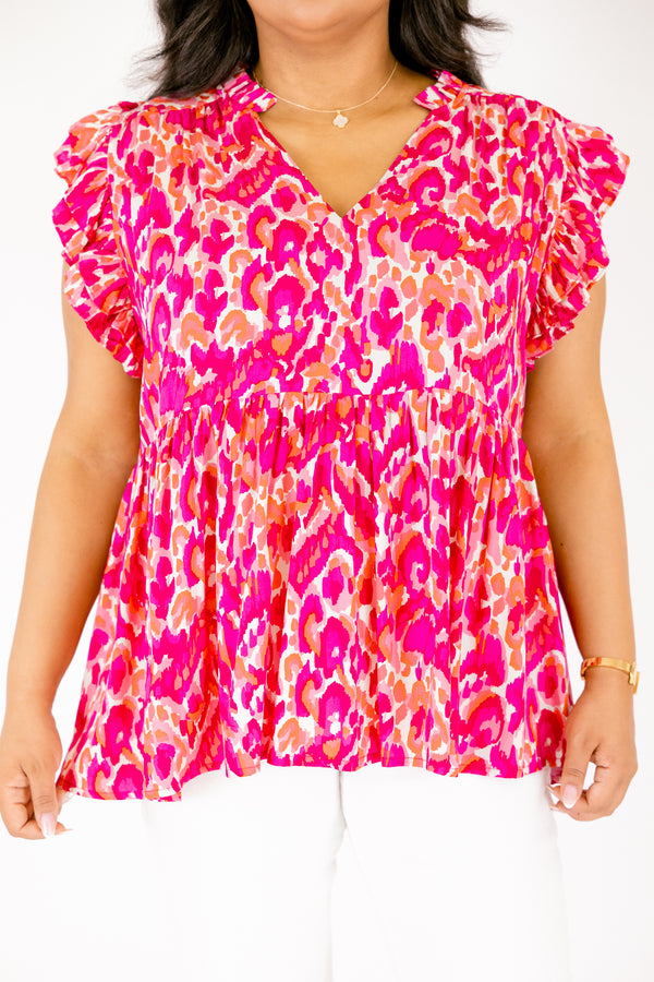   Chic Soul plus size clothing, pink top with flutter sleeves a v-neckline and a pink and orange abstract pattern 