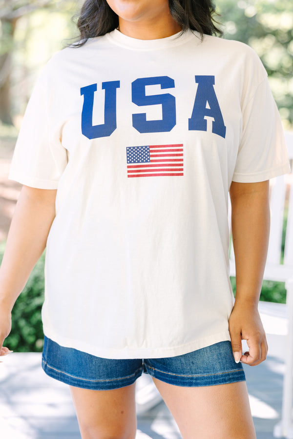 Chic Soul plus size clothing, white short sleeve tee with USA in navy block varsity style font with an American flag graphic below it