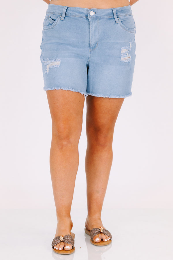Chic Soul plus size clothing, light wash mid thigh length destressed denim shorts with frayed hem and rips on the legs