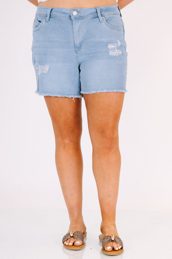 Chic Soul plus size clothing, light wash mid thigh length destressed denim shorts with frayed hem and rips on the legs