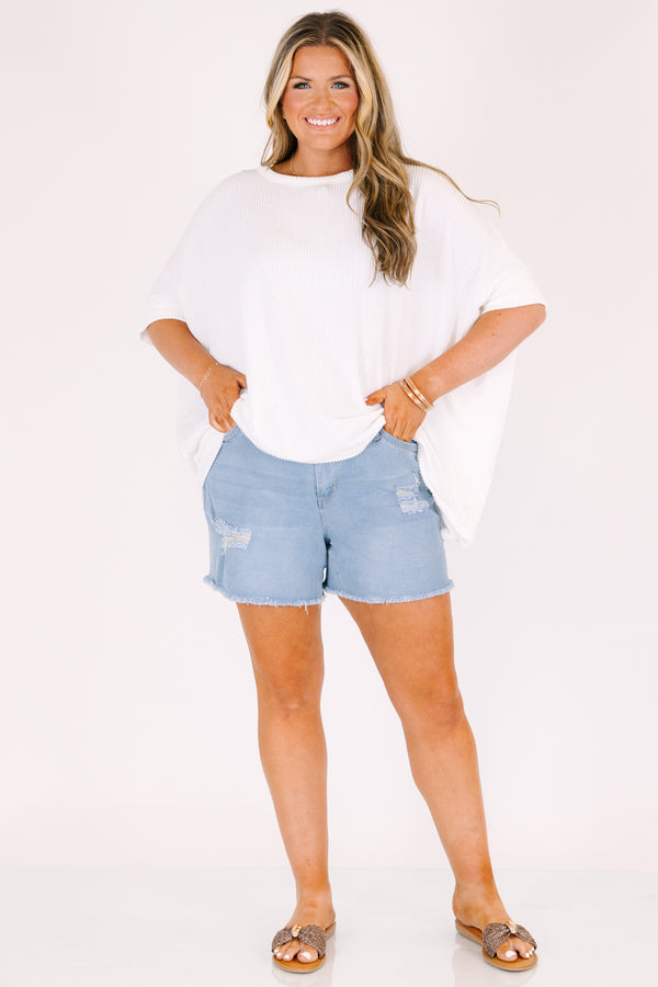 Chic Soul plus size clothing, light wash mid thigh length destressed denim shorts with frayed hem and rips on the legs