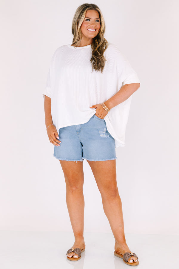 Chic Soul plus size clothing, light wash mid thigh length destressed denim shorts with frayed hem and rips on the legs