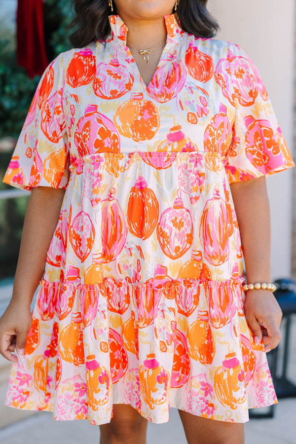 Plus Size short-sleeved tiered mini dress with a colorful pink and orange ornament print.