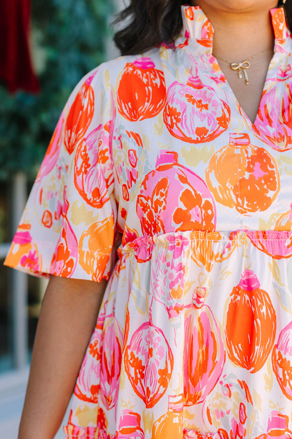 Plus Size short-sleeved tiered mini dress with a colorful pink and orange ornament print.