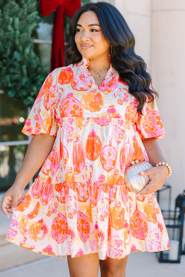 Plus Size short-sleeved tiered mini dress with a colorful pink and orange ornament print.