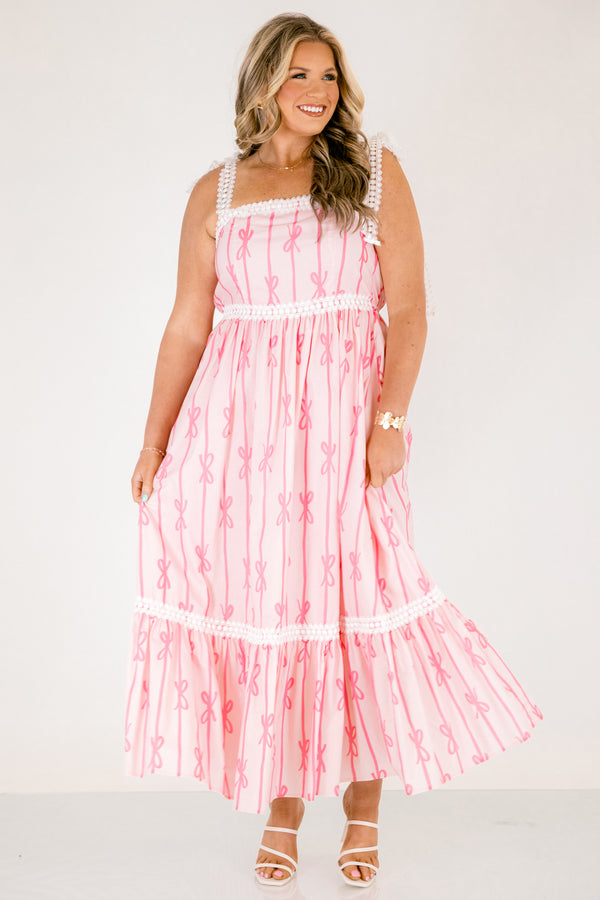 Chic Soul plus size clothing, light pink tiered maxi dress with dark pink bow pattern and white lacy ribbon trim and tie straps