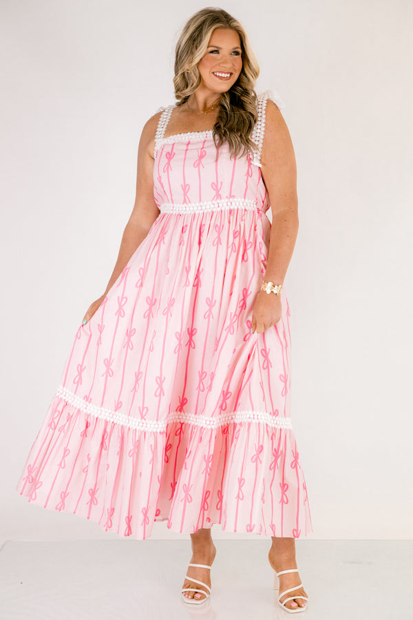 Chic Soul plus size clothing, light pink tiered maxi dress with dark pink bow pattern and white lacy ribbon trim and tie straps