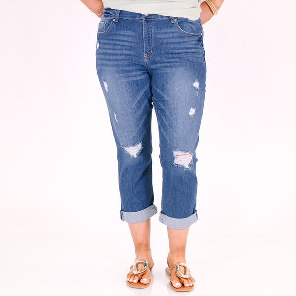Chic Soul plus size clothing, medium wash distressed denim capris with a cuffed hem.