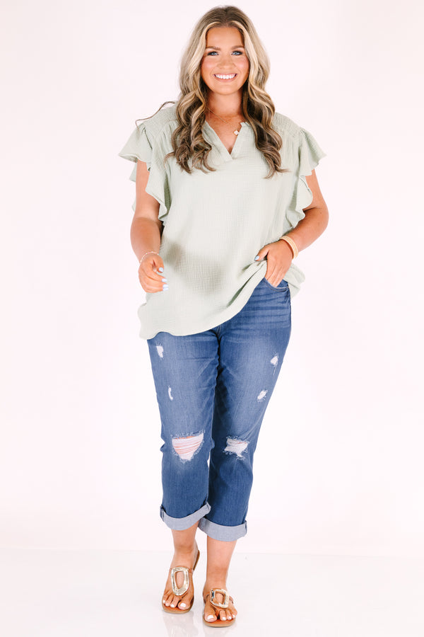 Chic Soul plus size clothing, medium wash distressed denim capris with a cuffed hem.