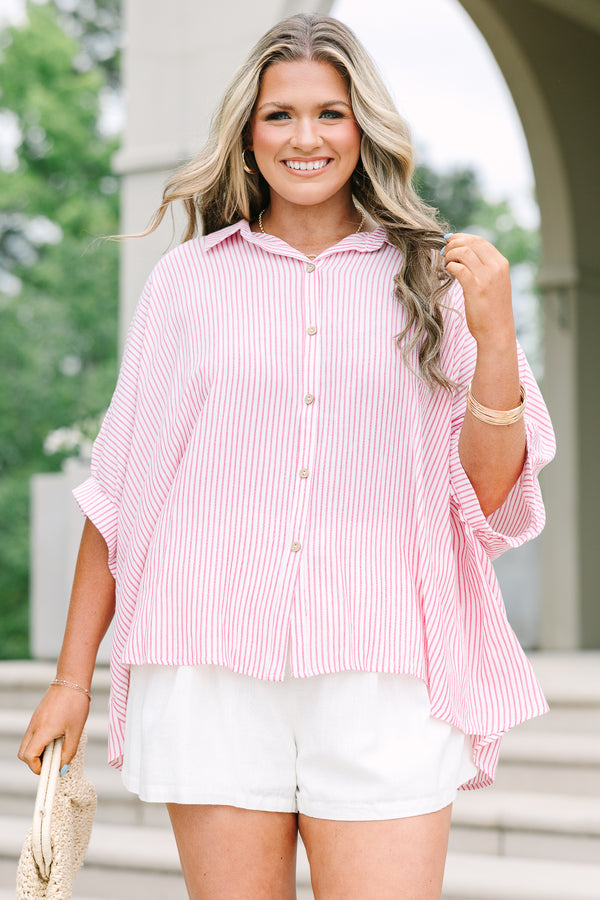 Relaxed red and white striped button-up top with dolman sleeves and a flowing silhouette.