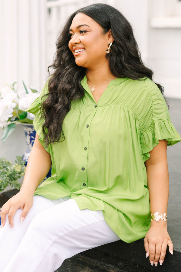 Chic Soul plus size clothing, green top with flutter sleeves and  buttons going down the center of the top as well a sinched detailing on the shoulder area of the top
