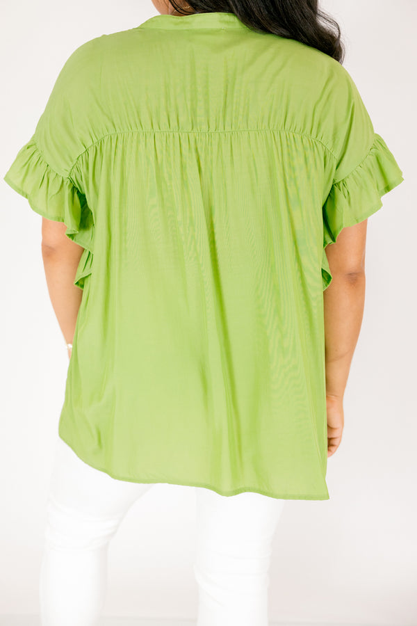 Chic Soul plus size clothing, green top with flutter sleeves and  buttons going down the center of the top as well a sinched detailing on the shoulder area of the top