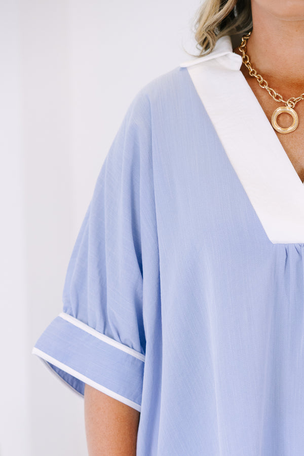 Plus Size light blue v-neck tunic top with white trim and short puff sleeves.
