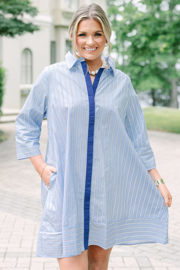 Plus size blue and white striped cotton shirt dress with three-quarter sleeves and a navy button placket.